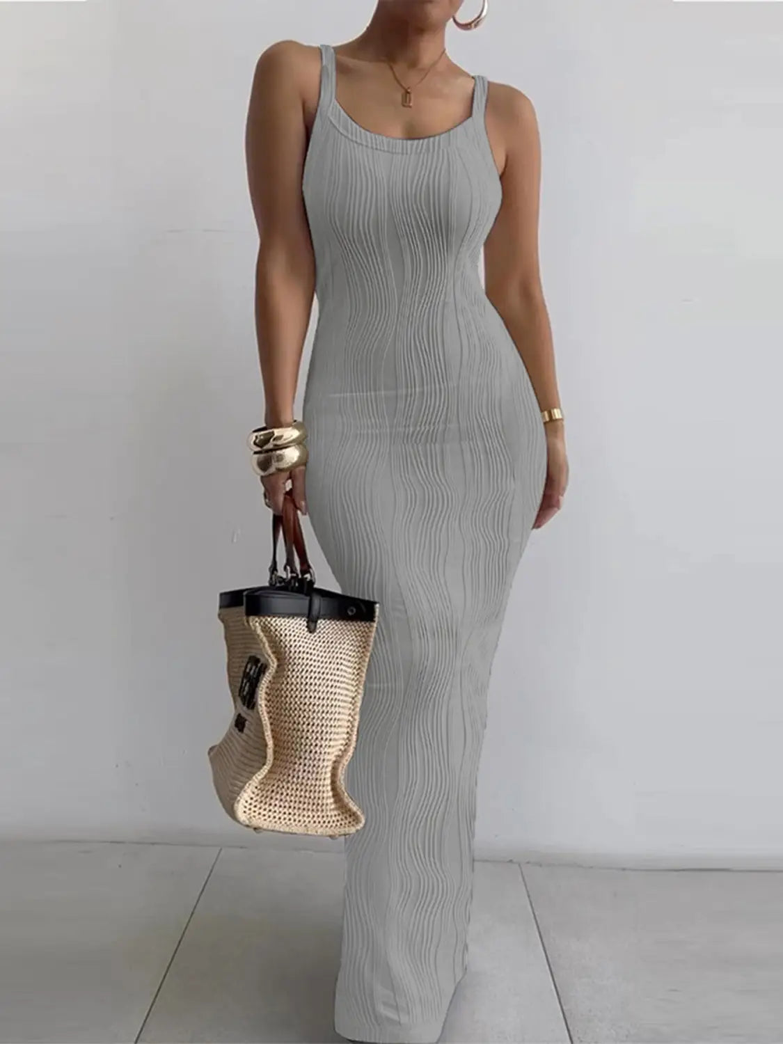 A sleek light gray ribbed knit sleeveless midi dress with a square neck and fitted silhouette.