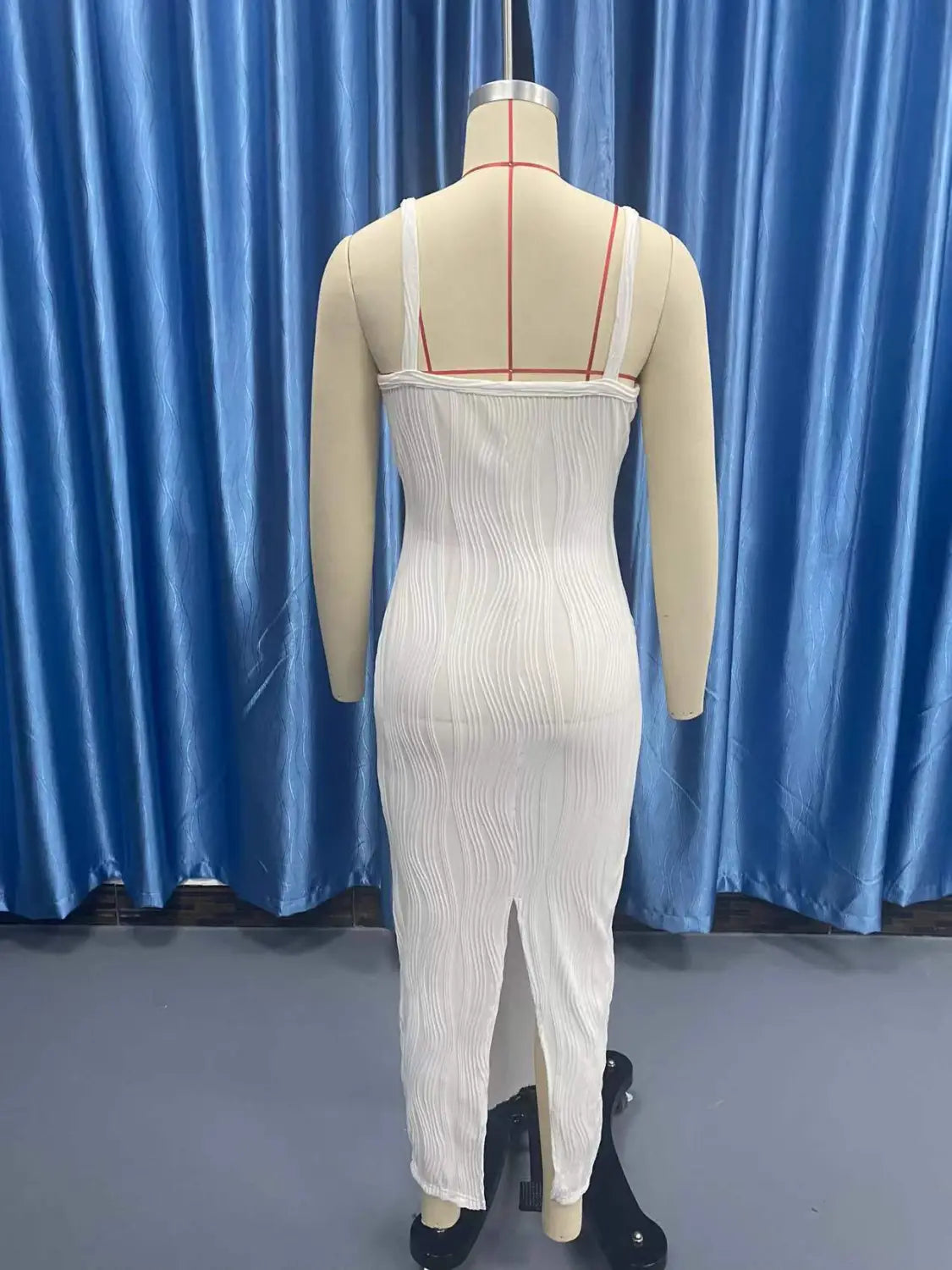 White ribbed knit sleeveless midi dress with pleated skirt thin straps square neck and front slit.