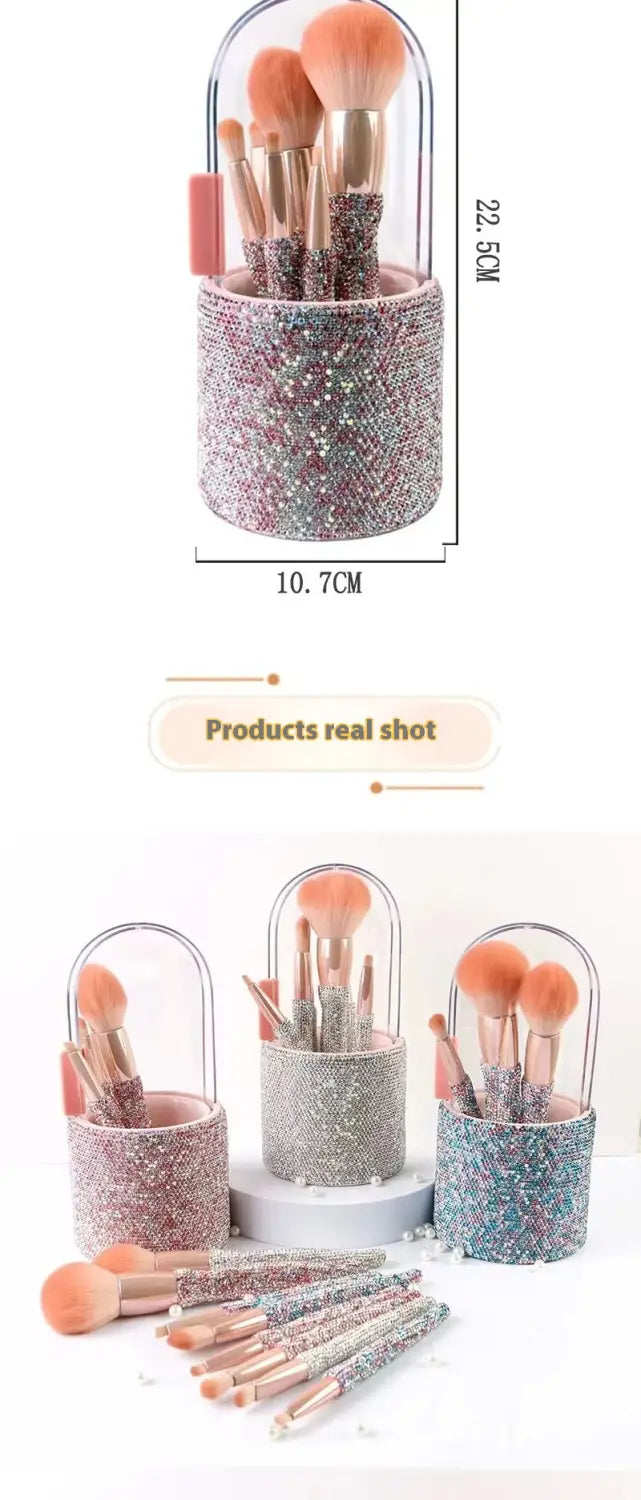 Diamond makeup brush set with a sparkly pink and silver glittered cylindrical brush holder featuring a clear plastic lid and rhinestone storage case.