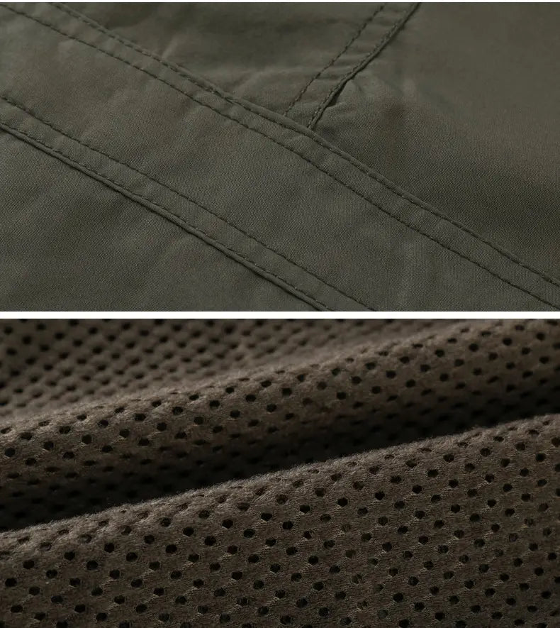 Men’s loose fit waterproof tactical hooded jacket in dark olive green fabric with reinforced stitching and breathable mesh lining.