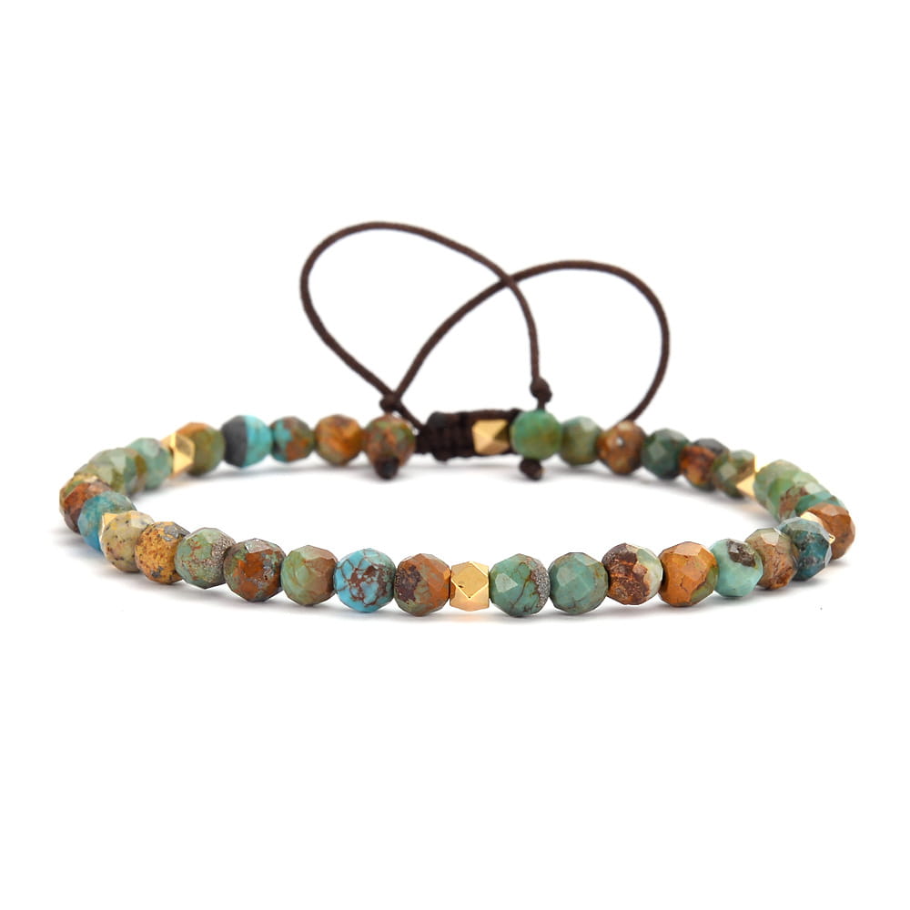 An adjustable African turquoise braided leather bracelet featuring faceted turquoise and copper-toned stones strung on a dark brown cord with gold-tone accents.