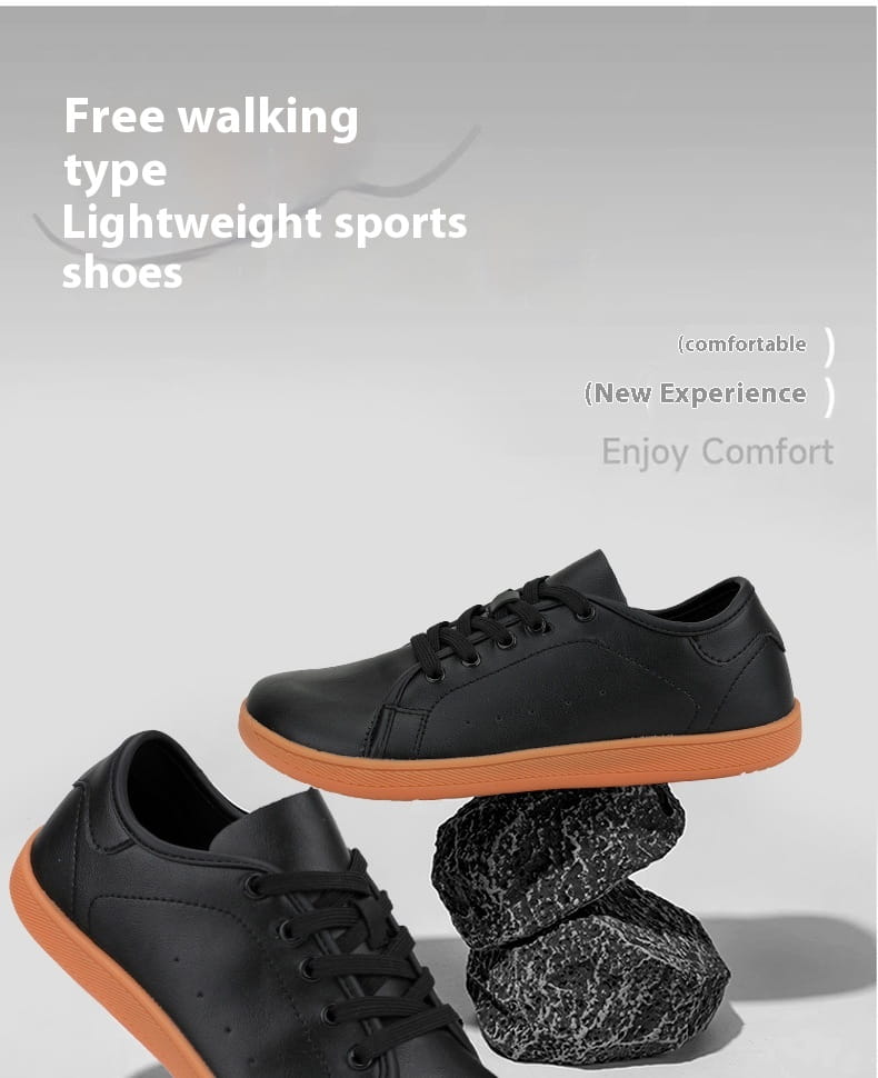 Zapatillas minimalistas antideslizantes de cuero negro de caña baja con puntera ancha y suela de goma naranja contrastante