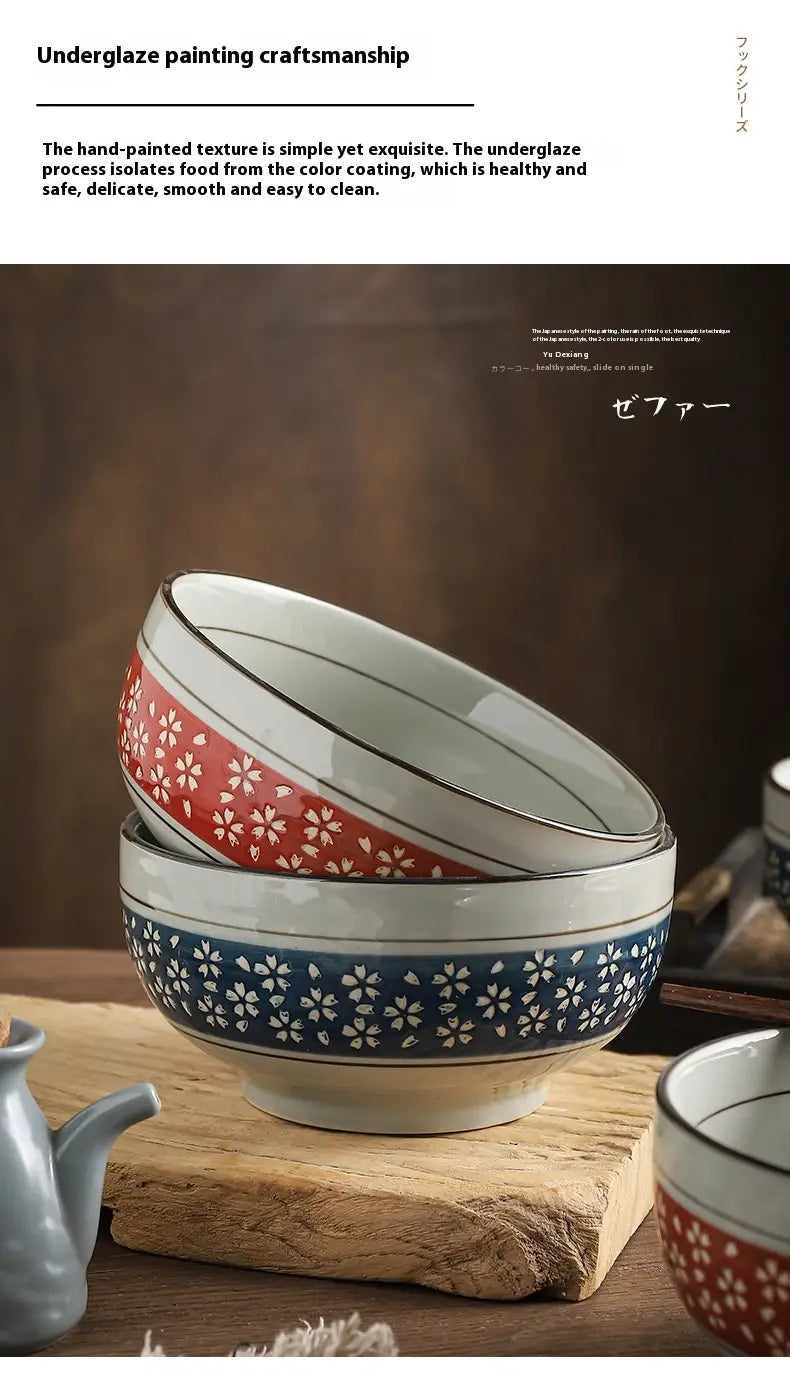 Stacked ceramic noodle bowls 7 inch with delicate red and blue underglaze cherry blossom floral patterns and smooth glazed finish.