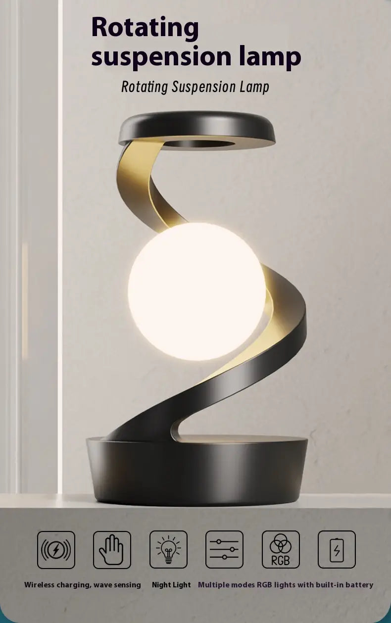 Black and gold rotating suspension lamp with spherical white bulb featured in the Moon desk lamp with wireless charging and sensor control.