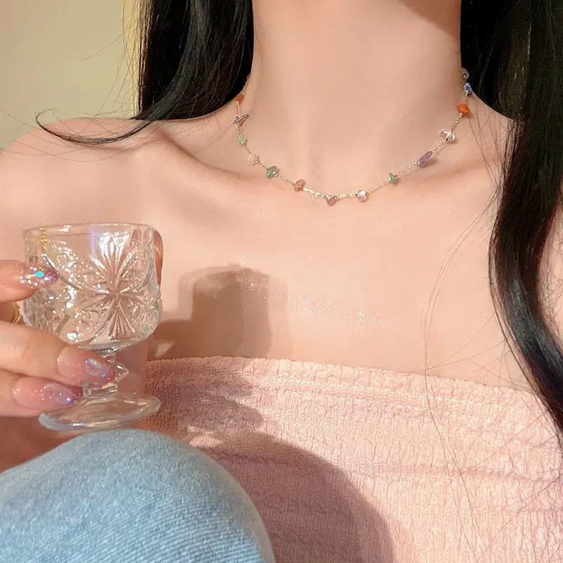 A delicate multicolor gemstone choker featuring a fine gold and silver alloy chain.