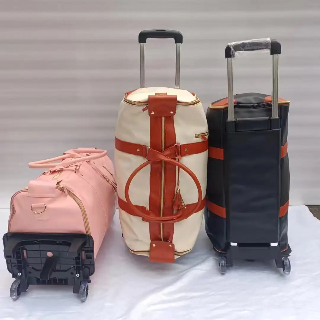 three rolling travel bags in pink, cream with orange straps, and black with orange accents featuring foldable large capacity design for fitness and travel use