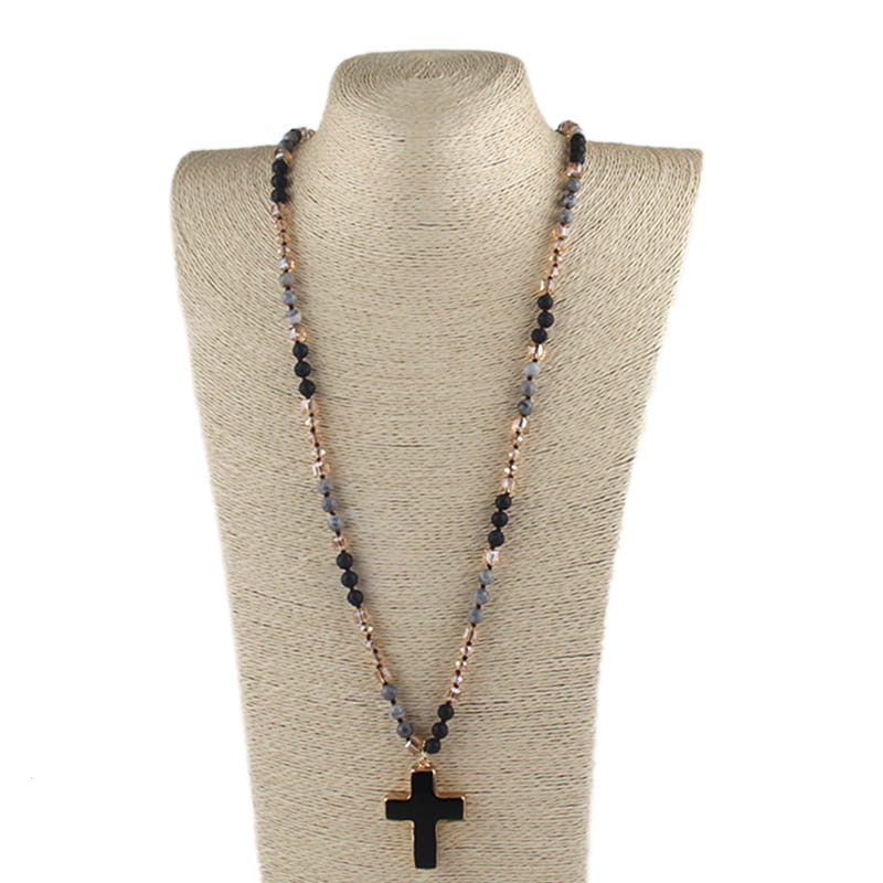 Bohemian natural stone and glass beaded cross necklace featuring a black cross pendant with alternating black and gray beads on a gold-toned chain.