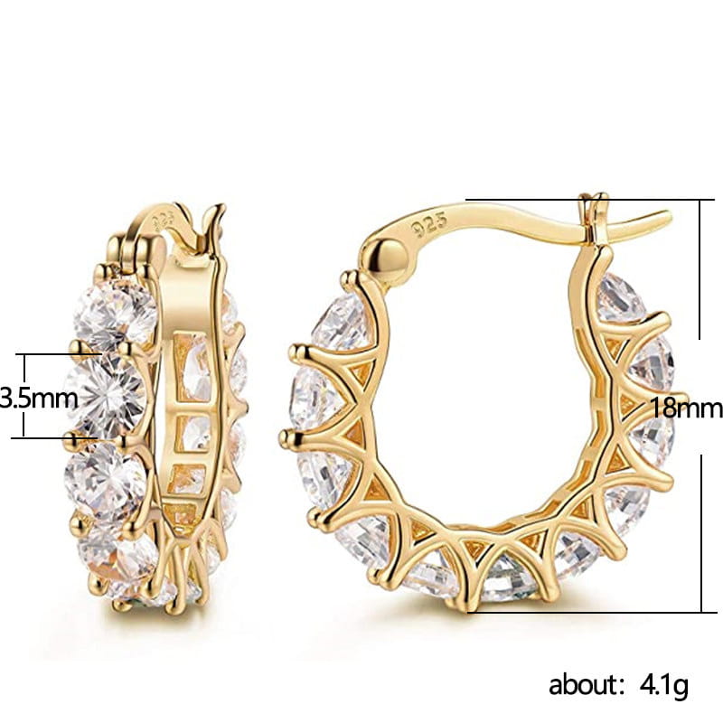 Gold-tone geometric u-shaped hoop earrings adorned with clear faceted zircon crystals set in an intricate lattice design.