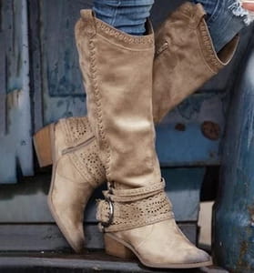 Women suede knight boots in tan with intricate beaded detailing and a decorative buckle strap.