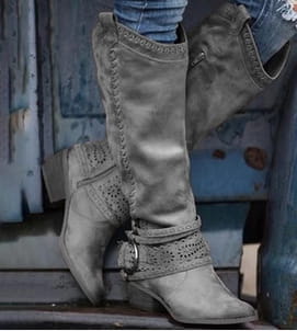 Women’s suede knight boots in gray featuring decorative stitching and a metallic buckle strap detail