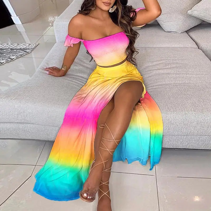 Bohemian off-shoulder two-piece maxi dress featuring a rainbow gradient color with ruffled shoulder straps and a high slit.