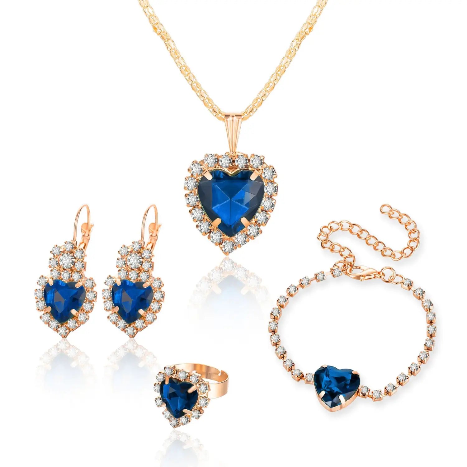 A 4 piece heart rhinestone jewelry set featuring elegant rose gold heart-shaped pieces with deep blue gemstones and sparkling clear crystals.