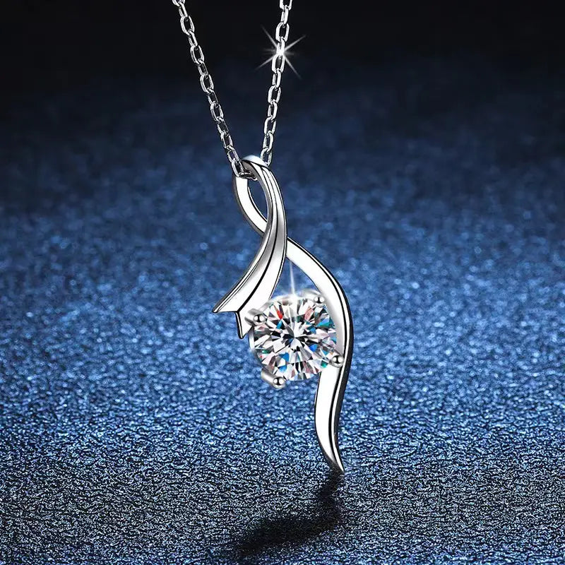 925 sterling silver twisted moissanite solitaire necklace with a central round-cut clear gemstone set within an elegant flowing metal design.