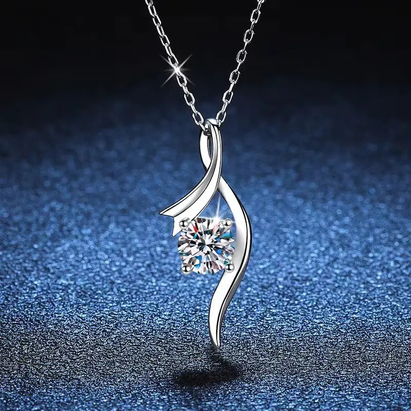 Silver necklace with a flowing twisted design in 925 sterling silver featuring a round-cut clear moissanite solitaire gemstone.