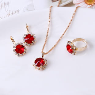 Elegant rectangular gemstone gold jewelry three piece set featuring red gemstones with gold-tone metal accents.