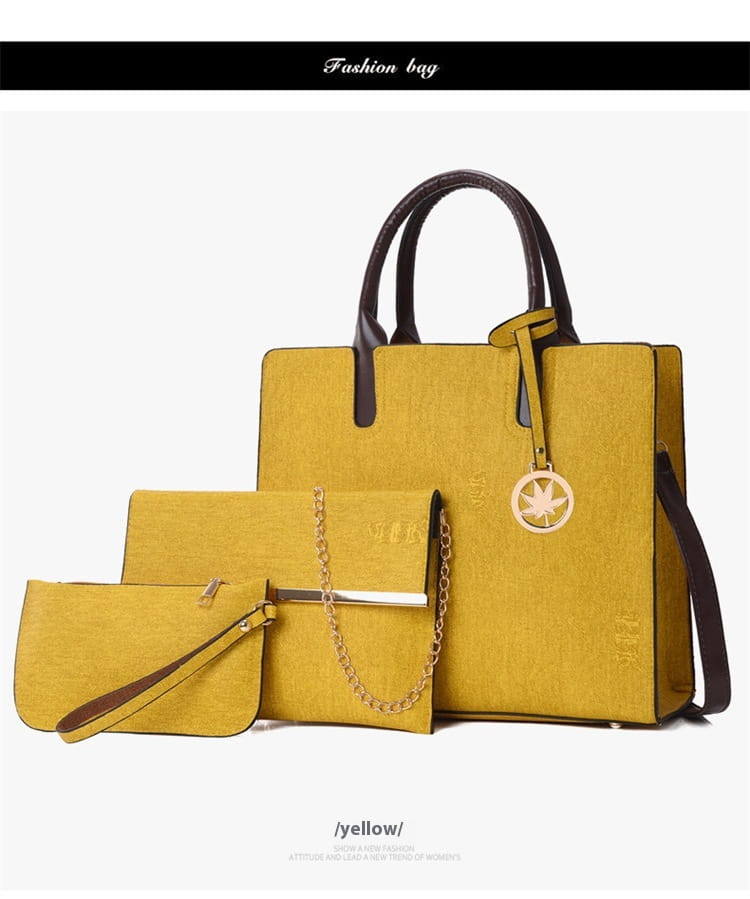 Yellow textured leather handbag with black handles and gold-tone chain accents from the denim and leather three piece multi compartment handbag set.
