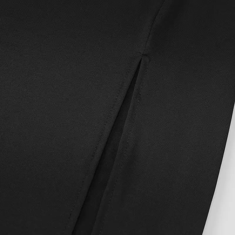 Black satin deep v neck backless midi dress with side slit showing subtle fabric texture and clean stitching on the back side seam.