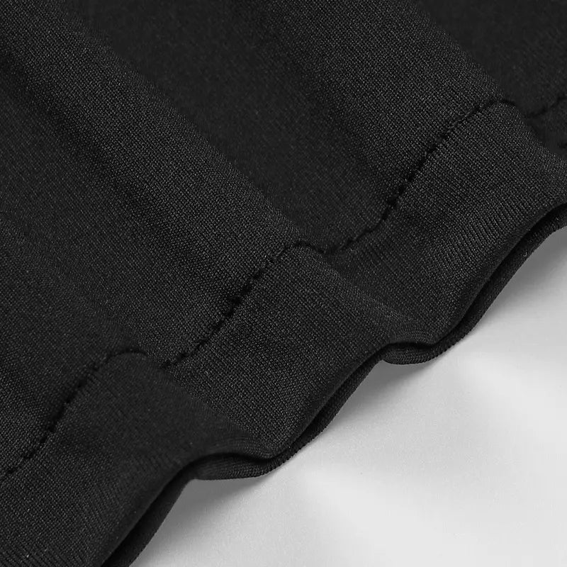 satin deep v neck backless midi dress in black ribbed knit fabric with a smooth slightly textured surface and neatly stitched seams showing the back side.