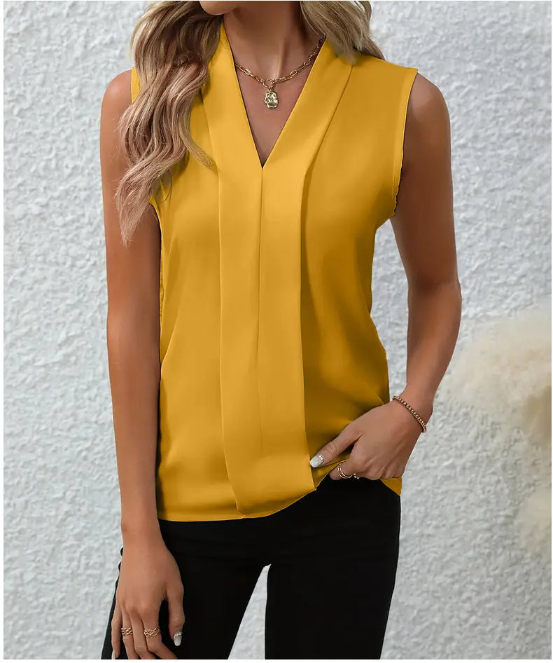A vibrant yellow chiffon sleeveless blouse for women featuring a v-neckline and subtle pleats down the front.