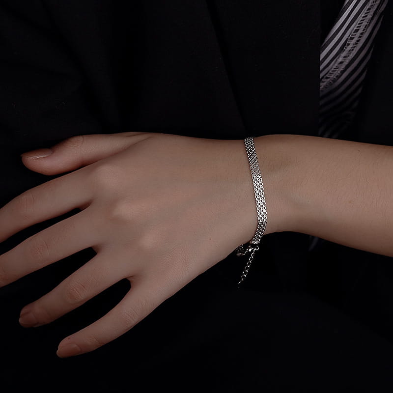 Multi-layer silver mesh heart clasp bracelet featuring a delicate silver chain clasp.