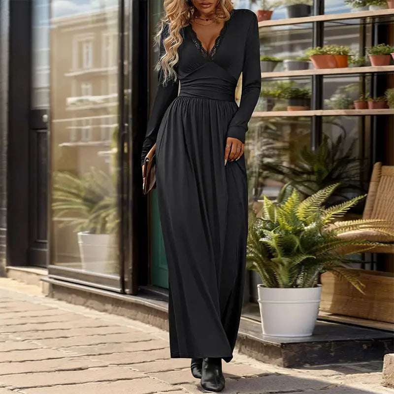 black long-sleeved maxi dress with v-neckline and lace trim featuring ruched detailing and a side slit for elegant occasions