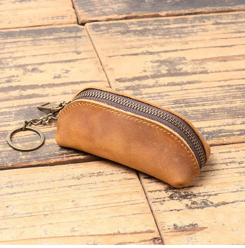 Premium cowhide leather multi-functional tan key and coin pouch with zipper closure and metal ring.