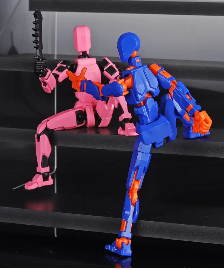 a blue and orange 3d printed multi jointed action figure dummy toy with a pink counterpart in a dynamic pose