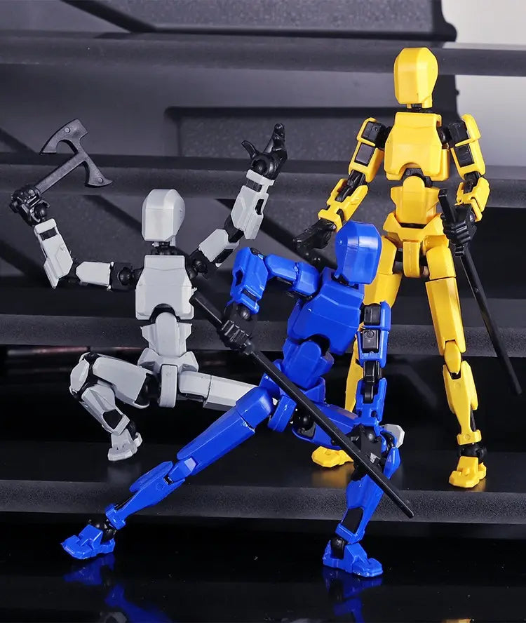 Three 3d printed multi jointed action figure dummy toys in white blue and yellow plastic with black joints are posed dynamically on a dark reflective surface.