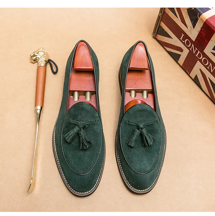 Men’s dark green suede tassel loafers with contrasting brown leather lining made from matte cowhide.