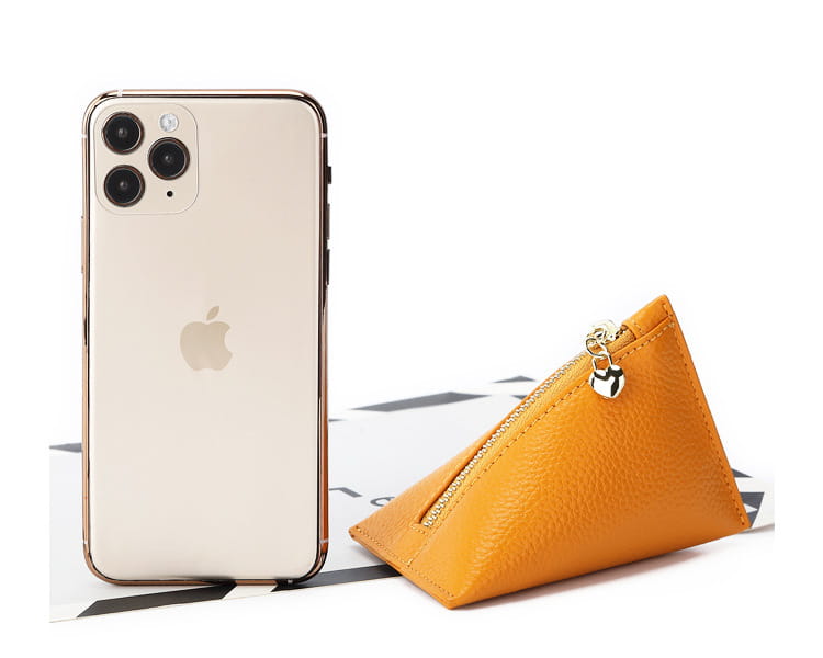 Orange genuine leather heart charm mini coin purse with a silver key shaped zipper pull in a triangular design.