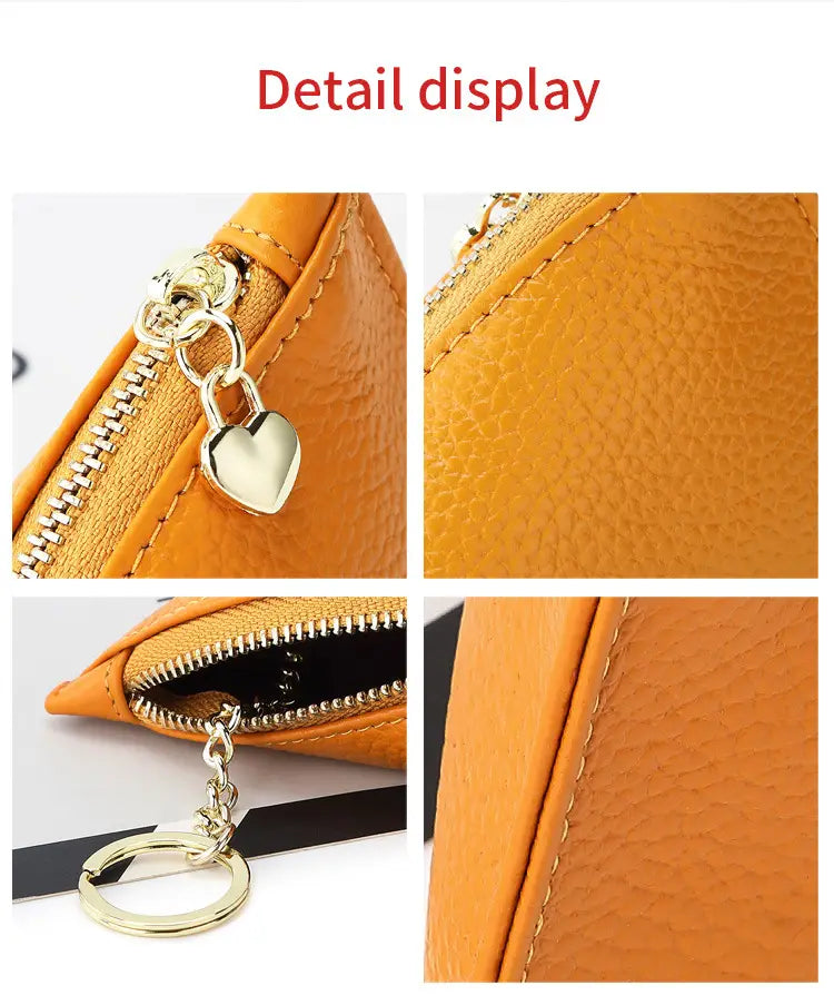 Genuine leather heart charm mini coin purse in orange textured leather with gold-tone zipper and heart-shaped lock charm.