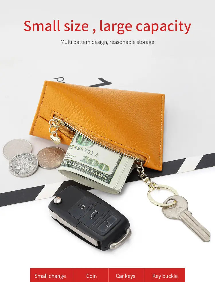 Genuine leather heart charm mini coin purse in tan with a compact design, zipper closure, and gold-tone hardware.