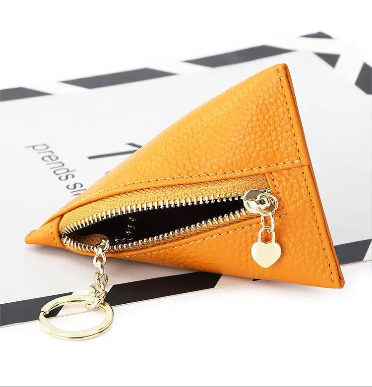 Genuine leather orange triangular mini coin purse with gold zipper and heart-shaped charm.
