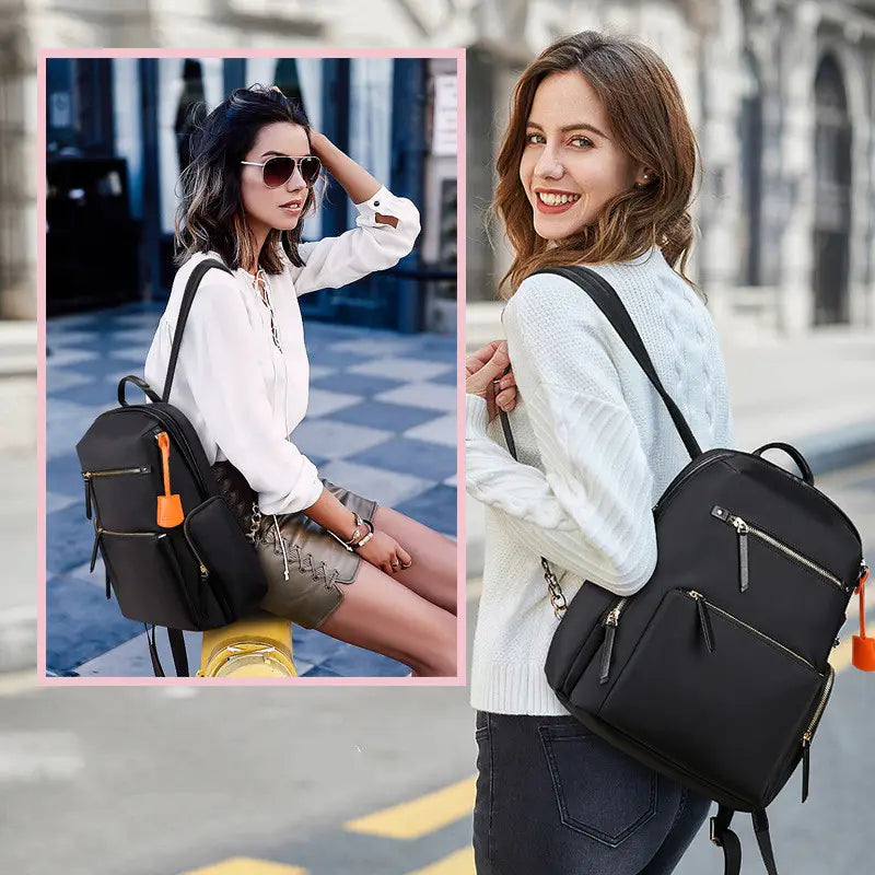 black women’s business nylon backpack with silver zippers and orange zipper pulls shown from the back side