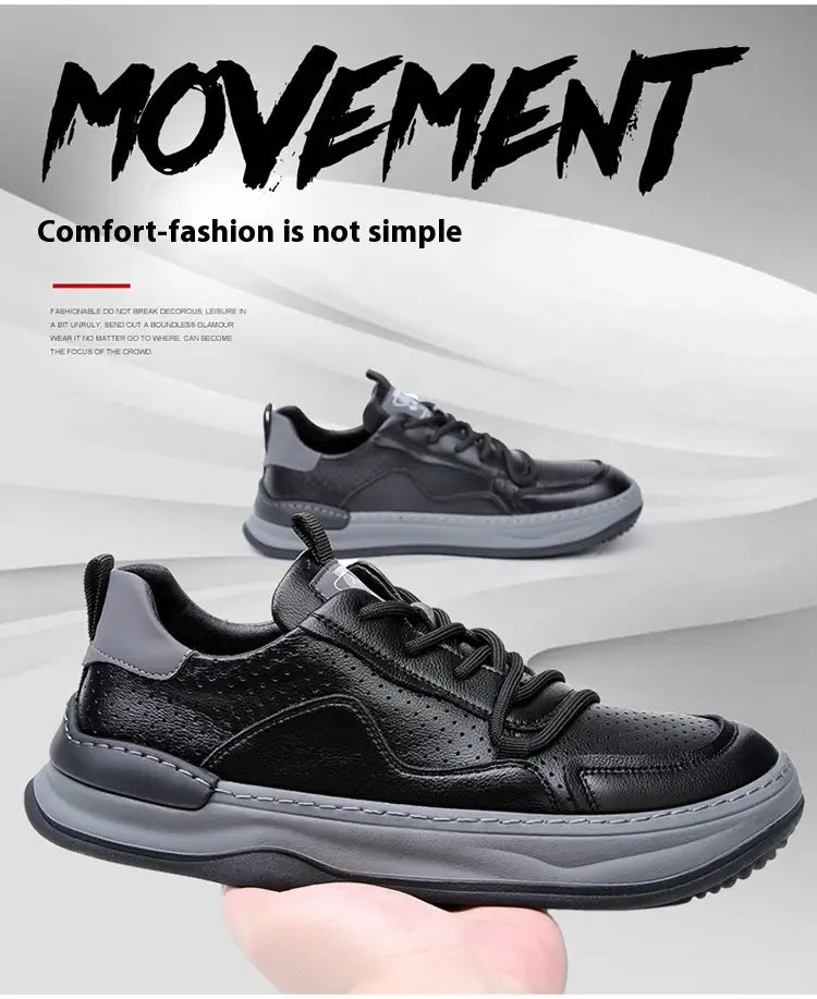 Men’s leather perforated breathable sneakers in black and gray with perforated leather uppers and chunky rubber soles.