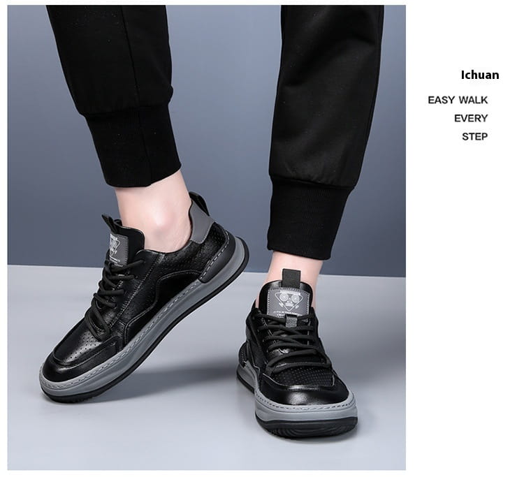 Black leather perforated breathable men’s sneakers with gray rubber soles and a subtle logo patch on the tongue.