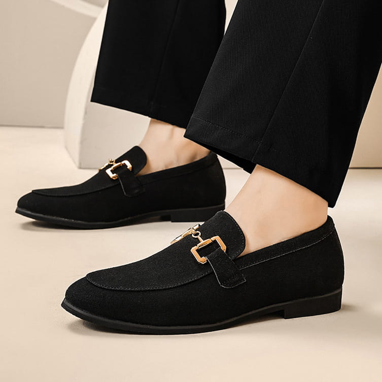 Black suede loafers for men with gold-tone buckle accents in black and khaki.