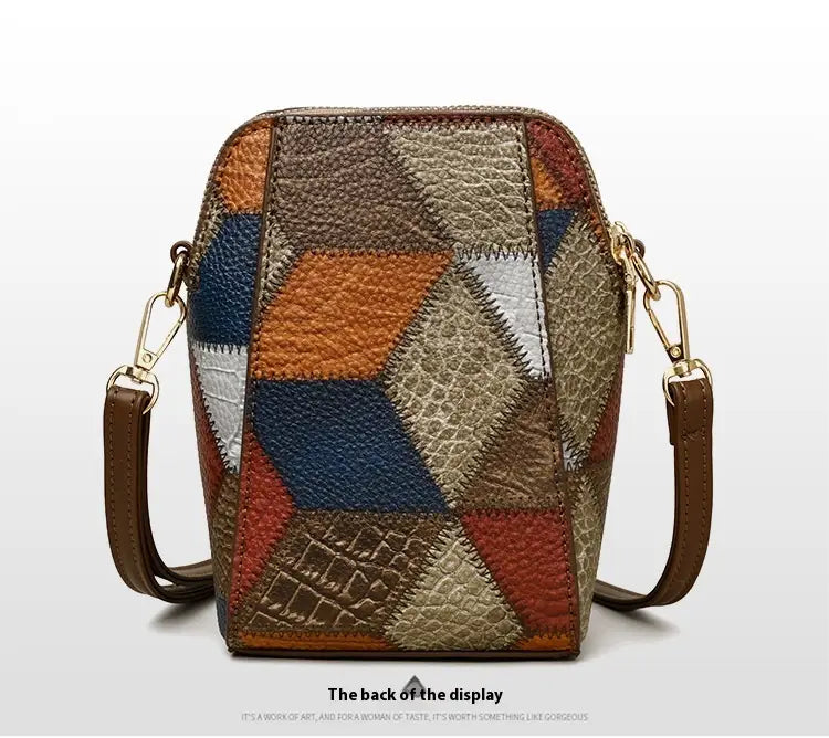 Two tone soft leather contrast stitch shoulder bag with patchwork geometric leather panels in earthy tones and gold hardware.