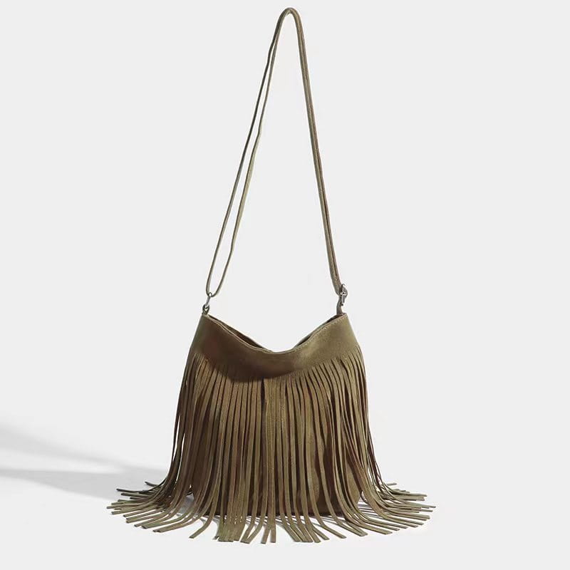 A maroon suede fringe crossbody bag with a long adjustable strap for artistic tassel canvas shoulder bag travel use.