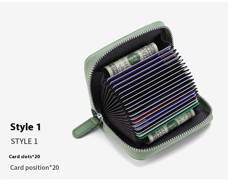 A compact sage green leather RFID card wallet with zipper coin pocket and 20 card slots.