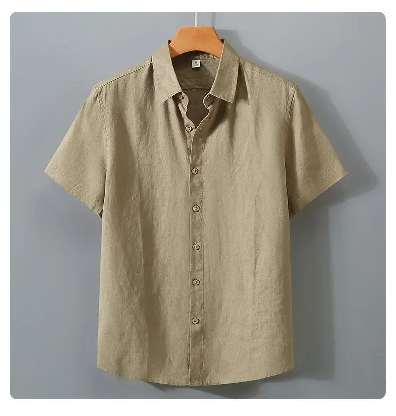 Beige short sleeve linen button up shirt with a classic collar and matching buttons in retro slim fit style.