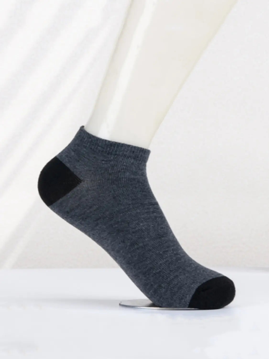 Men low cut socks dark gray with black toe and heel featuring soft knit sweat absorbent material for athletic use.