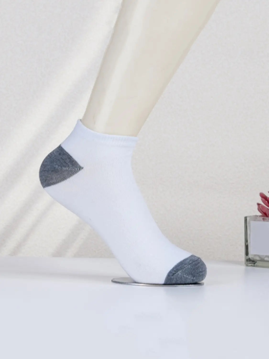men low cut athletic ankle sock in white with gray heel and toe accents designed for sweat absorption and comfort.