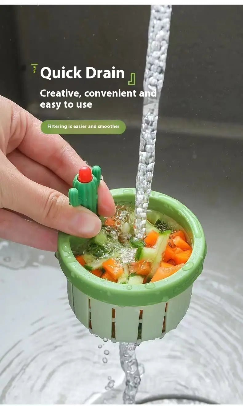 green cactus-shaped kitchen drain strainer basket filter net with a red top designed for quick and convenient filtering of vegetables under running water