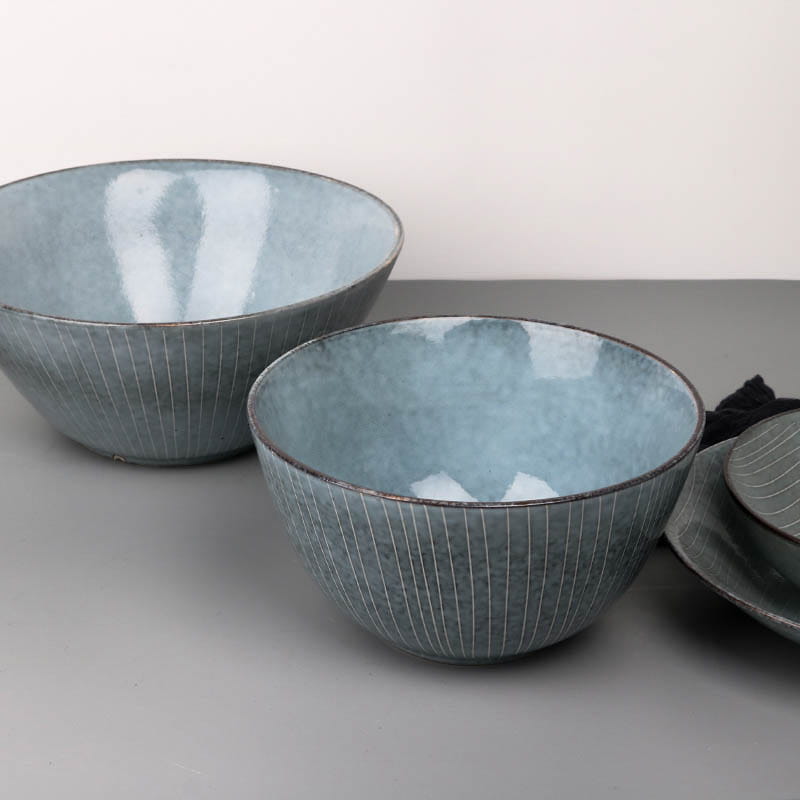 blue ceramic bowls with subtle vertical ridges and a matte finish from the ceramic dinnerware set retro ribbed plates and bowls