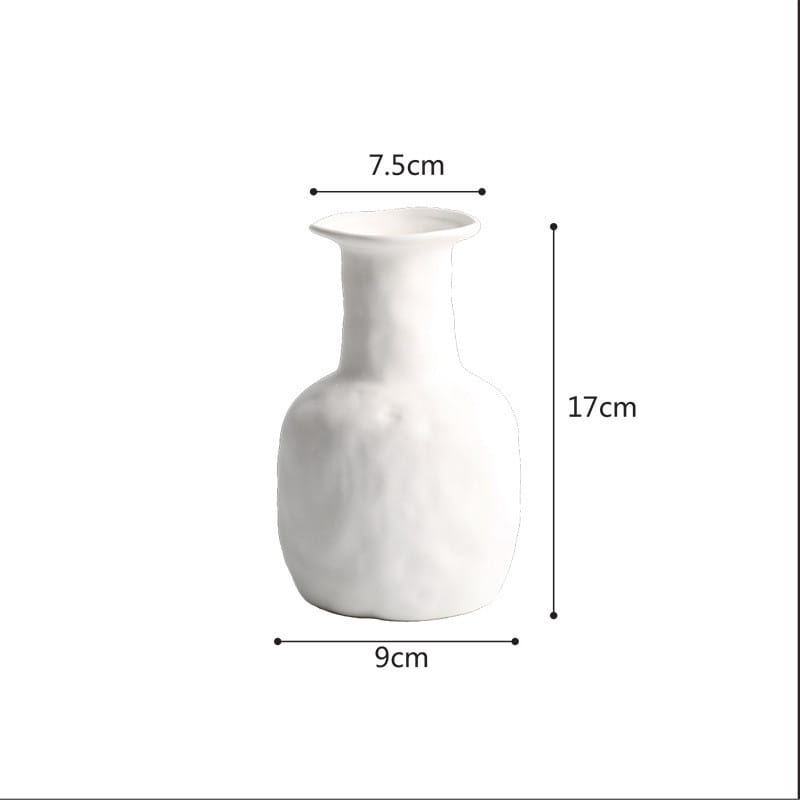 A minimalist white ceramic vase with a slender neck and rounded body measuring 17cm in height in a Scandinavian textured pottery style.