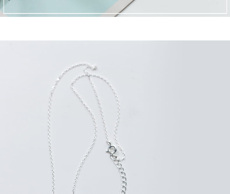 Silver-toned s925 silver fine chain necklace with a delicate clasp and extender links for personalized shell and pearl pendant necklace.