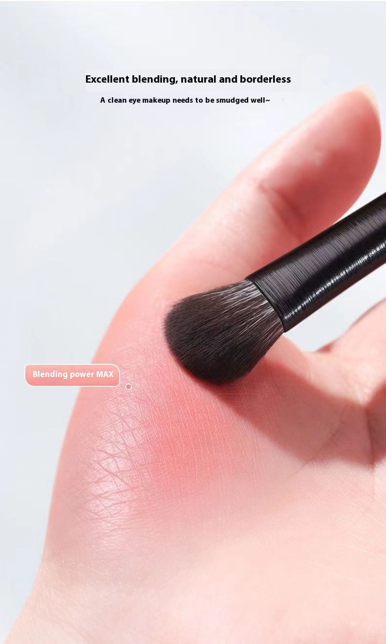 Black-handled makeup blending brush with dense soft bristles for seamless eye shadow application from black eye makeup brush set 10 piece matte tools.