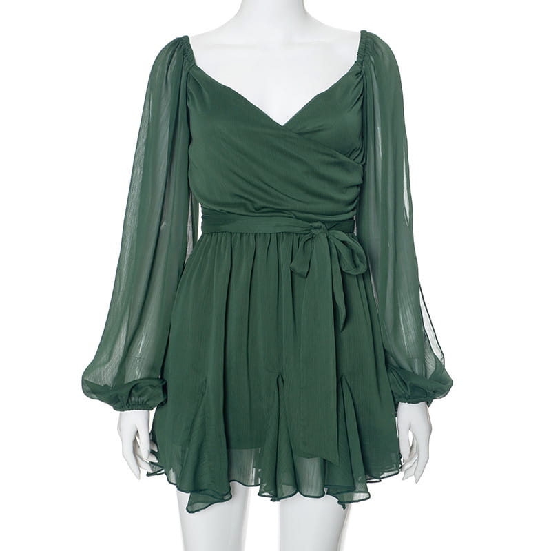 A ruched chiffon long sleeve mini dress in flowing emerald green chiffon with long sheer puff sleeves and a self-tie waistband.