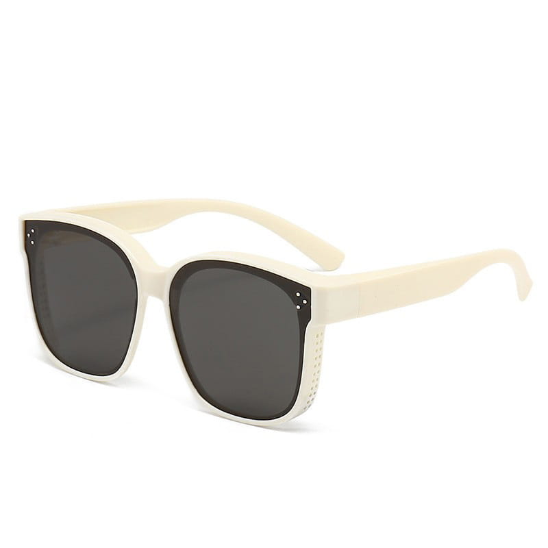 Polarized square anti glare driving sunglasses in cream-colored acetate with dark gray lenses and subtle perforated detailing on the temples.